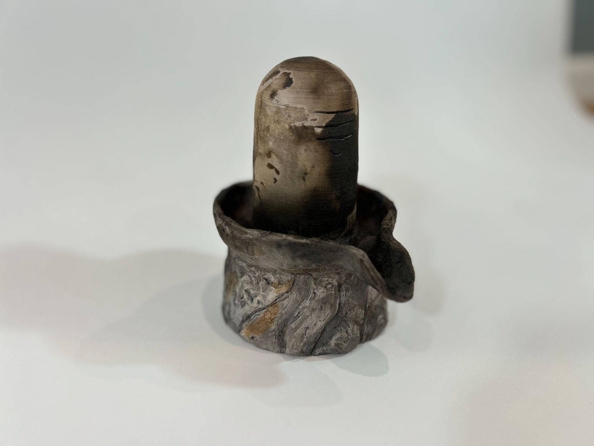 A pit-fired sculpture made from wild river clay